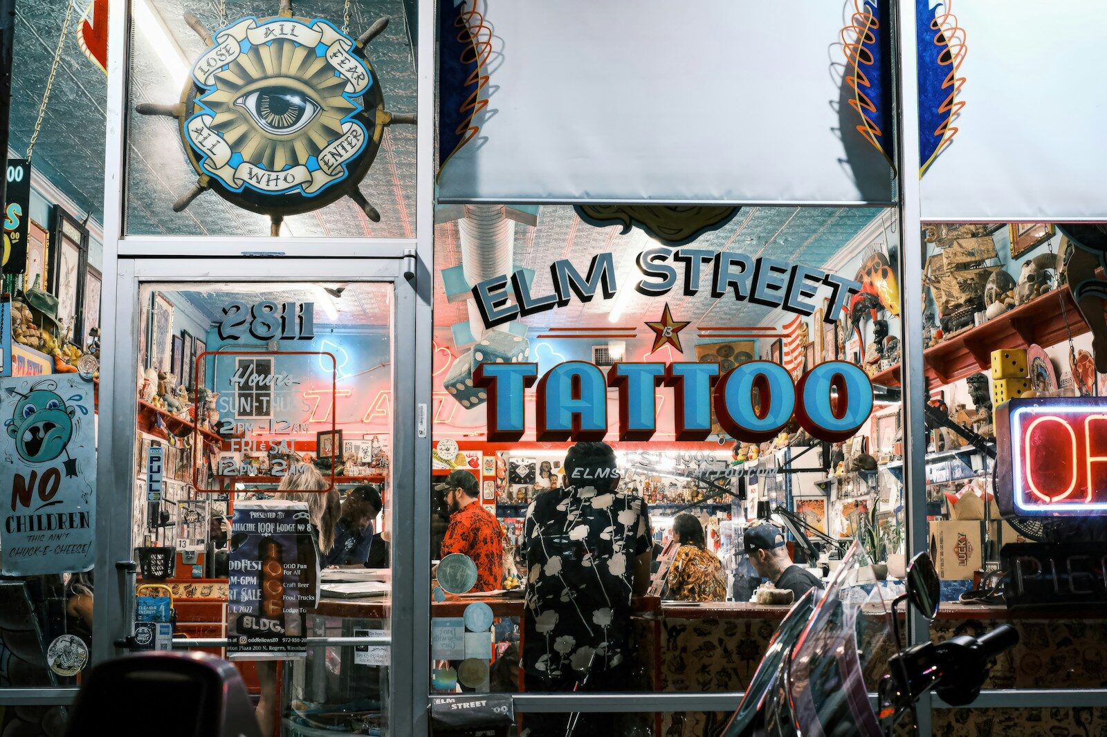 Elm street tattoo shop exterior at night