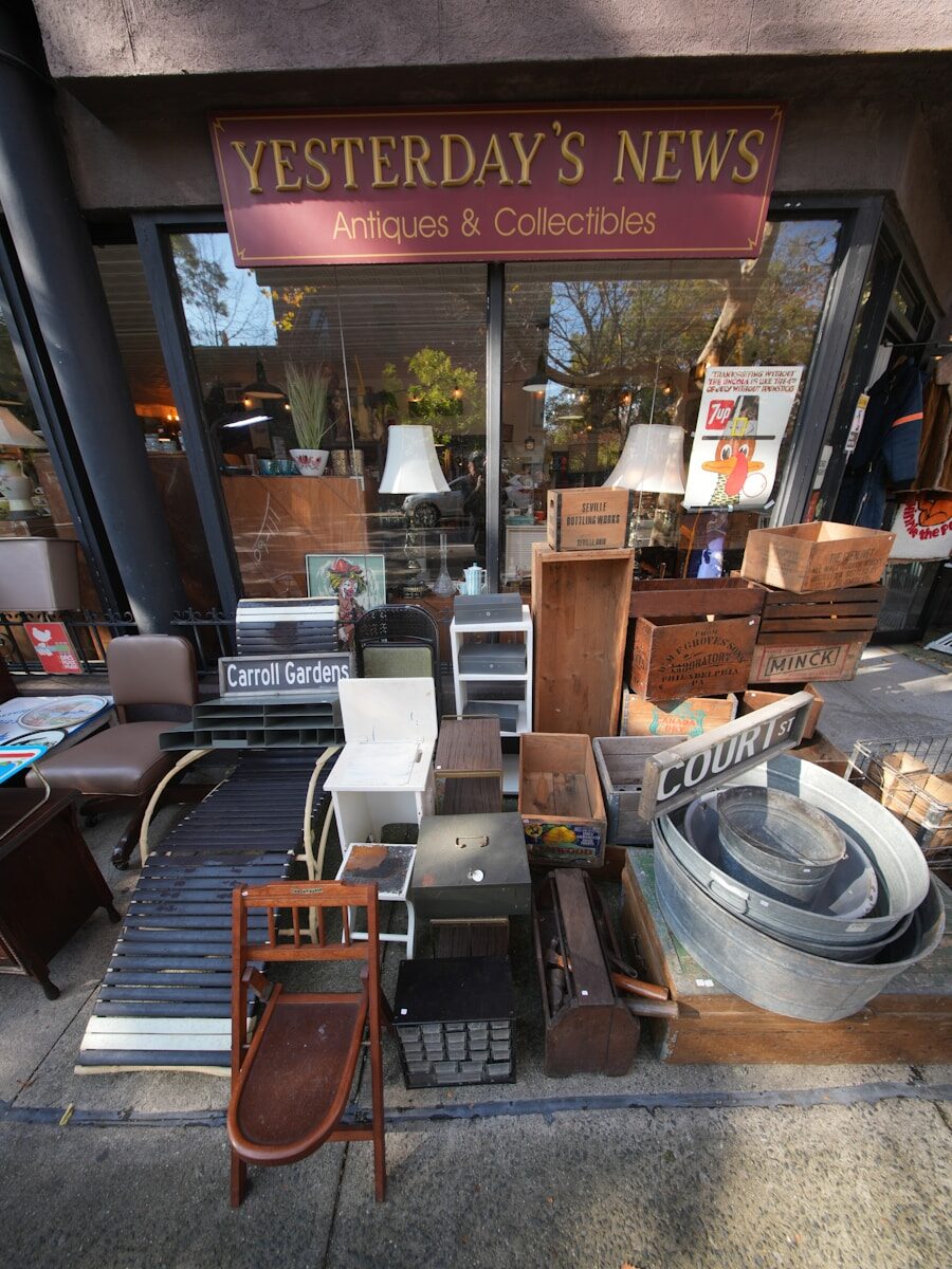 Antiques and collectibles displayed outside a shop entrance.